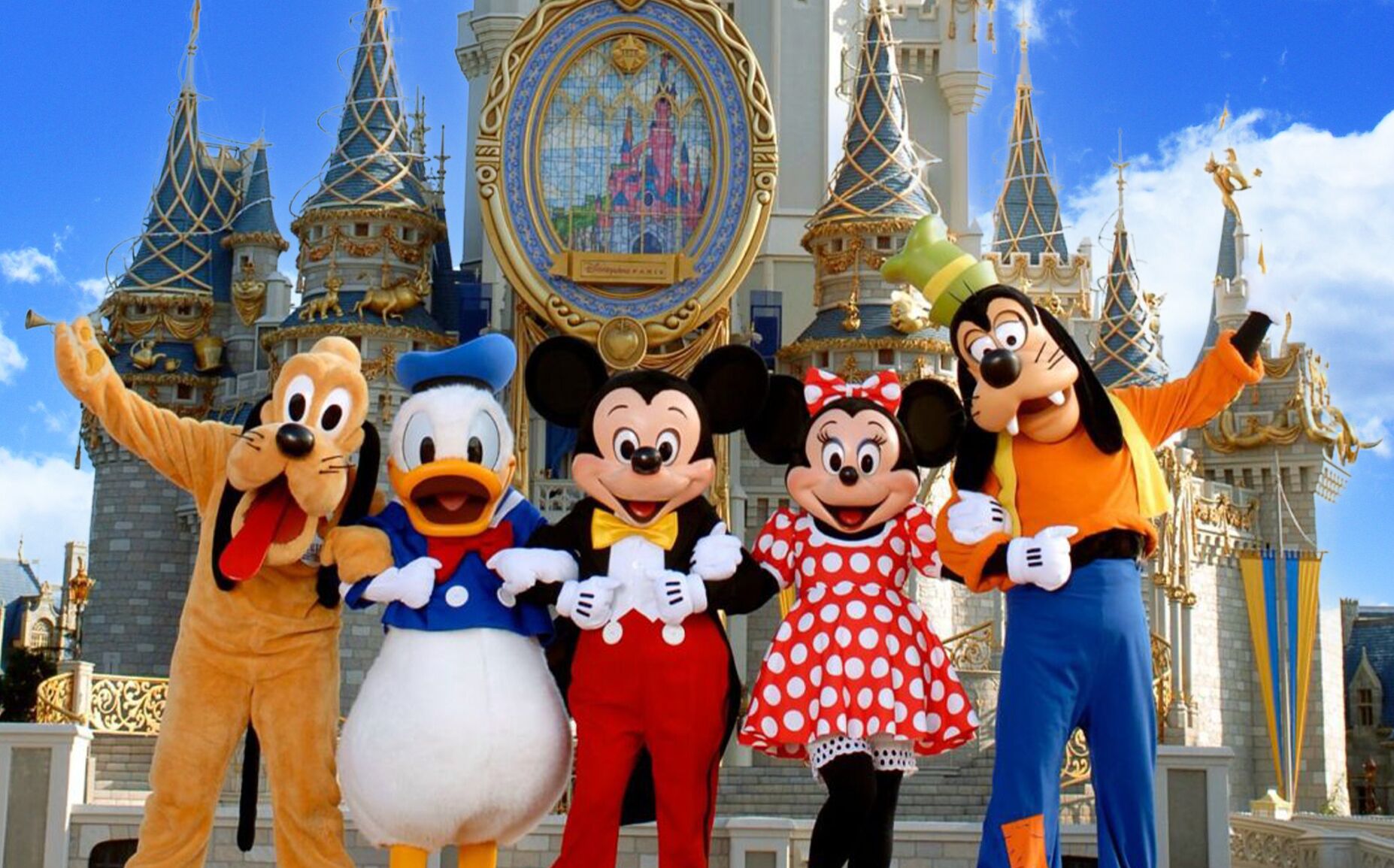 A group of animated characters in front of a castle-like building with multiple spires and a large circular window.