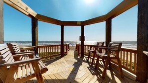 Guests can enjoy a scenic ocean view from this deck, featuring comfortable benches.