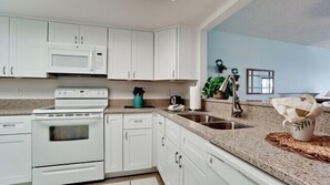 Fridge, microwave, oven, dishwasher - Gulf Watch 104 - Condo 2 Bedroom / 2 Bath Gulf to Bay access, maximum occupancy of 6 people. (Bradenton Beach)