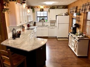 Fully equipped modern kitchen with a standard coffee pot