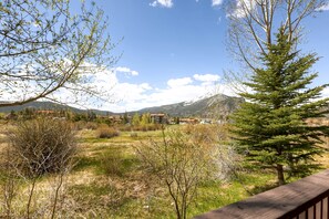 Enjoy the breathtaking mountain views from a balcony or deck, surrounded by lush greenery.