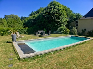 Outdoor pool, open 10 AM to 8 PM, pool loungers