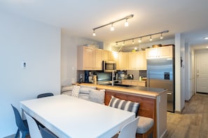 Dining area with 4 chairs and a bench