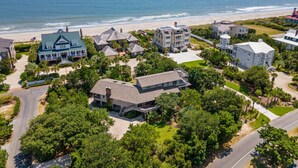 A coastal residential area with multiple houses, a beach, and a clear view of the ocean. - Natural and Serene Home Away from Home (Georgetown)