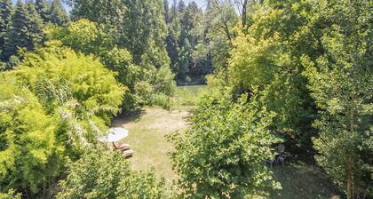 Roskamp ~ Riverfront Cabin with Large Yard, Seasonal River Dock & Boats
