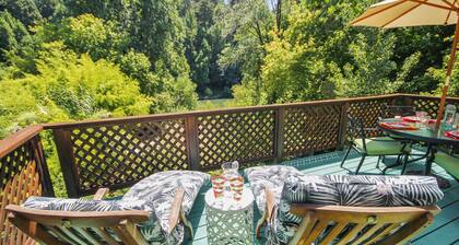 Roskamp ~ Riverfront Cabin with Large Yard, Seasonal River Dock & Boats