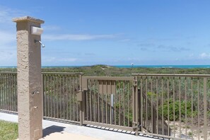 Secure entrance to an estate with a beautifully manicured landscape.