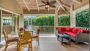 A covered outdoor patio with a dining table, chairs, a sofa, and a ceiling fan. - LAST MINUTE DISCOUNT SPECIAL! Central A/C Double Master Suite Home. (Kailua-Kona)