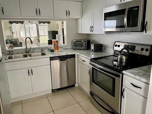 Fridge, microwave, dishwasher, coffee/tea maker