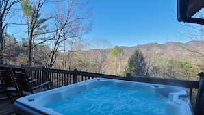 A hot tub on a wooden deck with a view of mountains and trees. - Mountain Cabin,Pool Table,Views,Hot Tub,Fireplace, WiFi, Pet Friendly (Ferguson)
