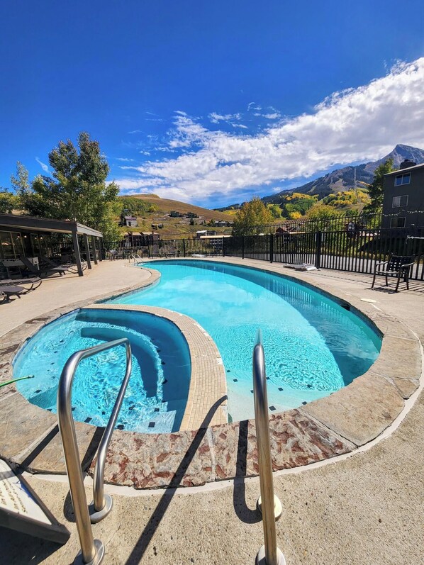 Outdoor pool, a heated pool - Charming condo on the free shuttle loop with a pool & hot tub! Great location! (Mt. Crested Butte)