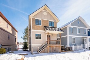 A two-story house with a front porch, a staircase, and a small deck. - Swim, Ski & Scenic Lake Views by Deep Creek Lake (MCHENRY)