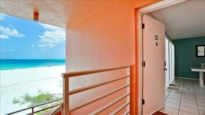 A balcony with a view of a beach and ocean. - Coquina Beach Club 202 - Anna Maria Island- Condo 2 Bedroom/ 2 Bath ocean view, maximum occupancy of 6 people. (Bradenton Beach)