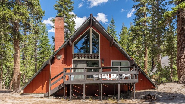 A cabin with a triangular roof, a wooden deck, and a chimney. - Chalet #14, Great Family Chalet Close the the Main (Mammoth Lakes)