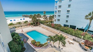 A hotel with a pool, beach view, and outdoor seating area. - Beach Palms 203 - 3 Bedroom / 2 Bath - Gulf View Condo (Indian Shores)