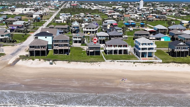 A coastal residential area with houses, a beach, and a lighthouse. - Aloha Cabana: 2  BR, 1  BA House in Crystal Beach, Sleeps 8 (Crystal Beach)