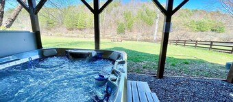 Waters Edge Riverfront Cabin | Hot Tub, Firepit & New River Views for the Whole Family