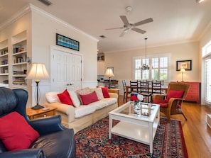 Relax in this inviting living room with a sofa, armchair, and coffee table.