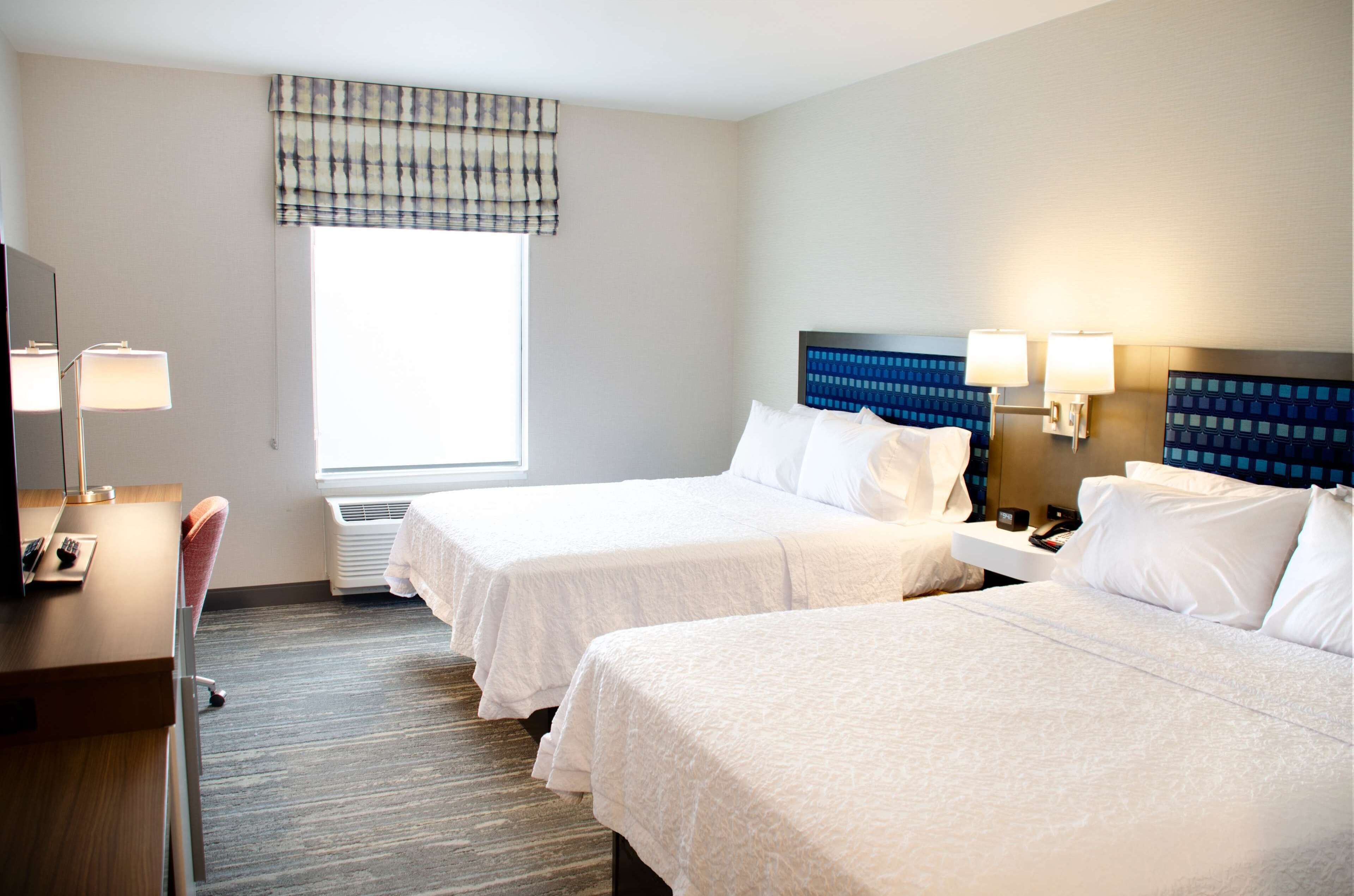 room, 2 queen beds, refrigerator & microwave | in-room safe, desk, cots/infant beds, free wifi