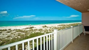 A balcony with a view of a beach and ocean. - Anna Maria Island Club 12 - Condo 2 Bedroom/ 2 Bath beach view, maximum occupancy of 4 people.  Community pool, Max 1 vehicle. (Bradenton Beach)