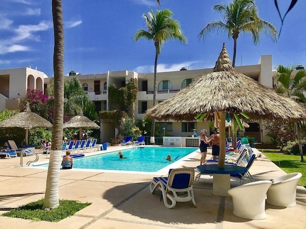Outdoor pool, pool umbrellas, sun loungers