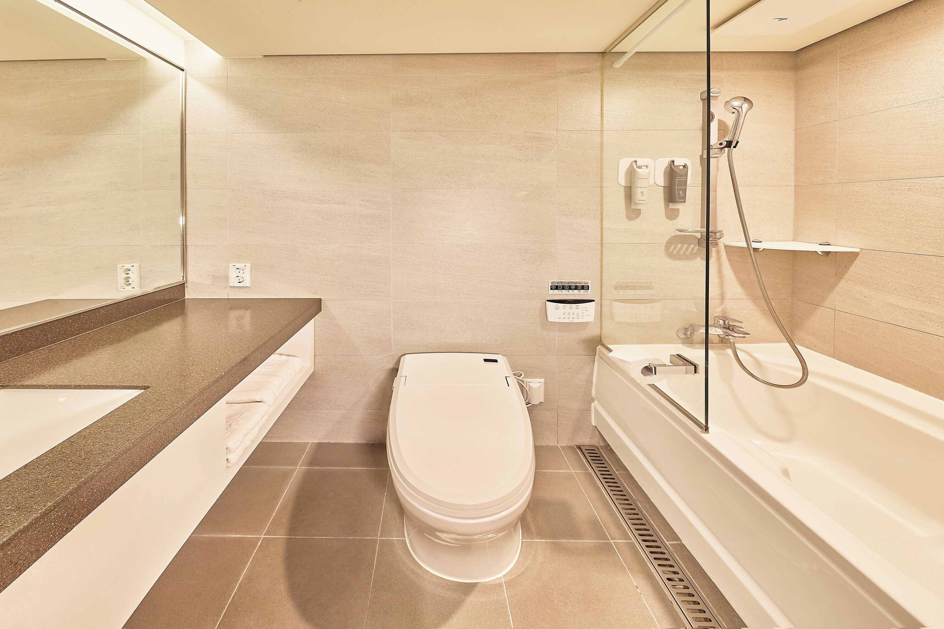 superior double room | bathroom | hair dryer, slippers, bidet, towels