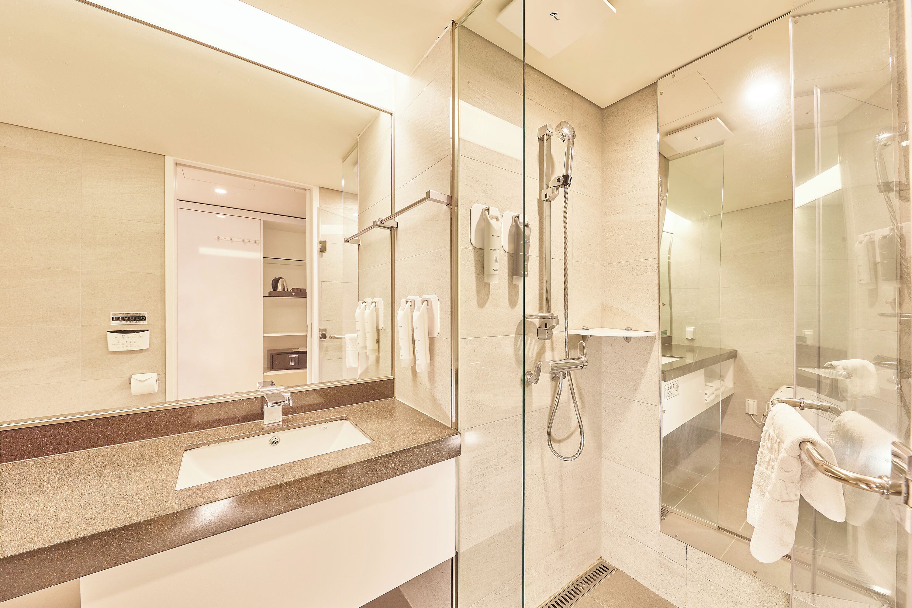deluxe twin room | bathroom | hair dryer, slippers, bidet, towels