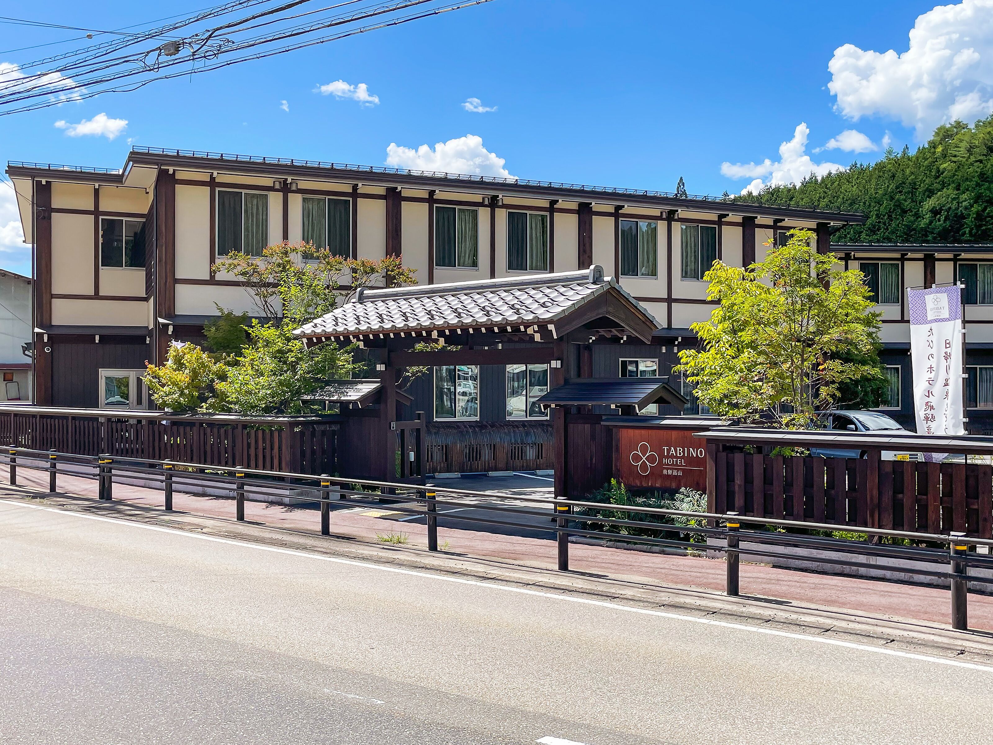 A traditional Japanese-style building with a wooden facade and a tiled roof.