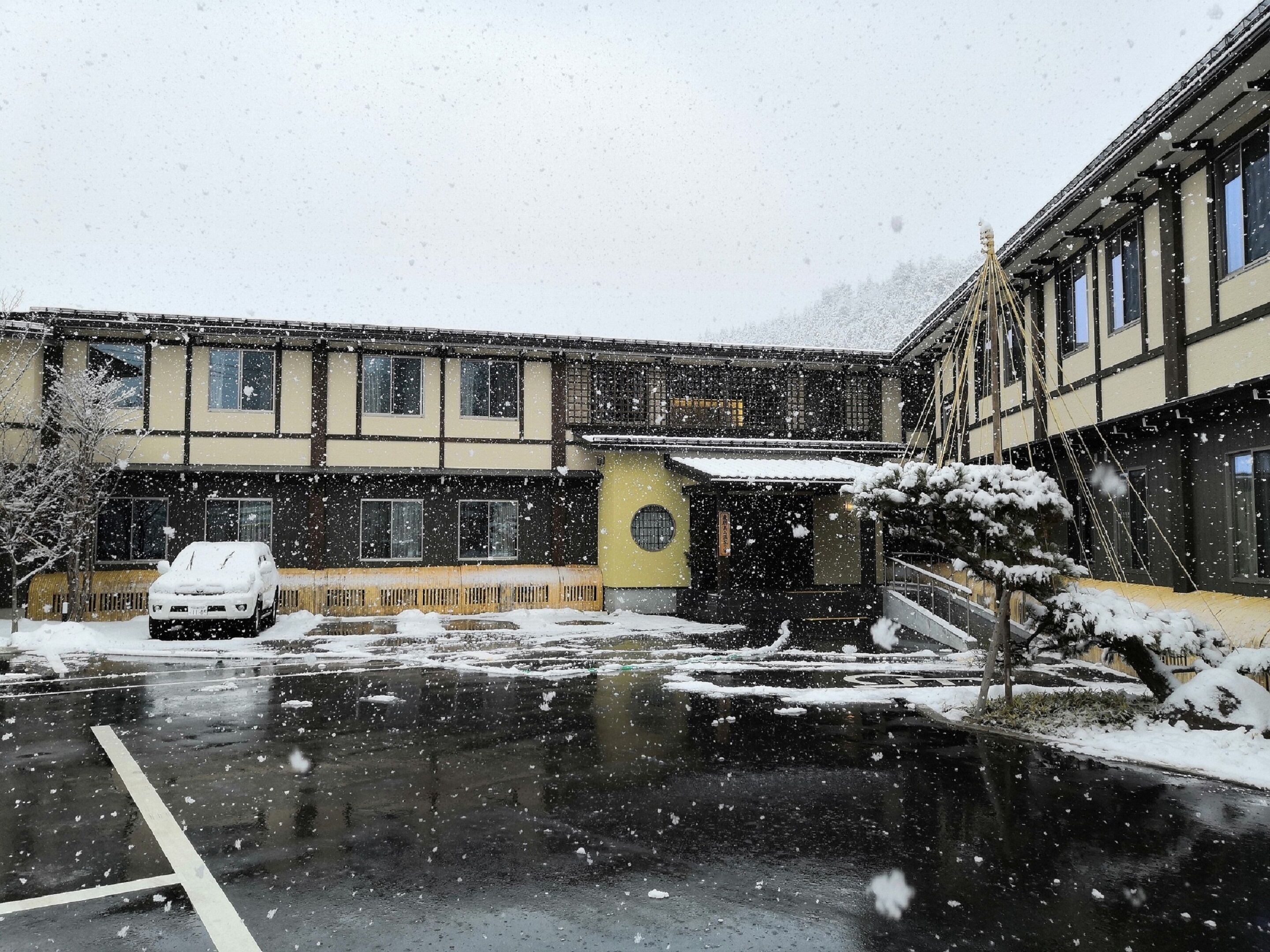 A building with a traditional architectural style, featuring multiple windows and a central entrance.