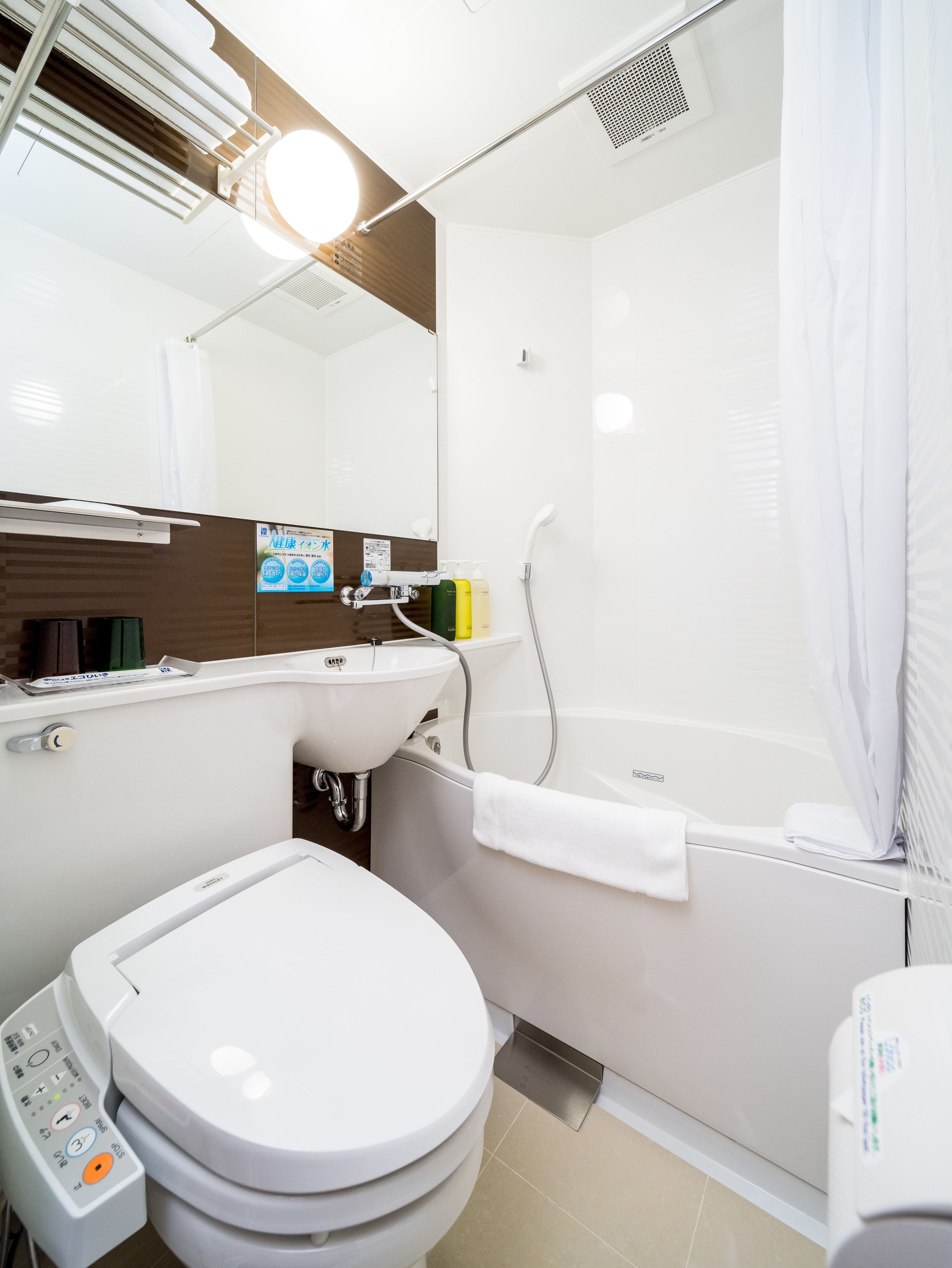 combined shower/bathtub, free toiletries, hair dryer, slippers