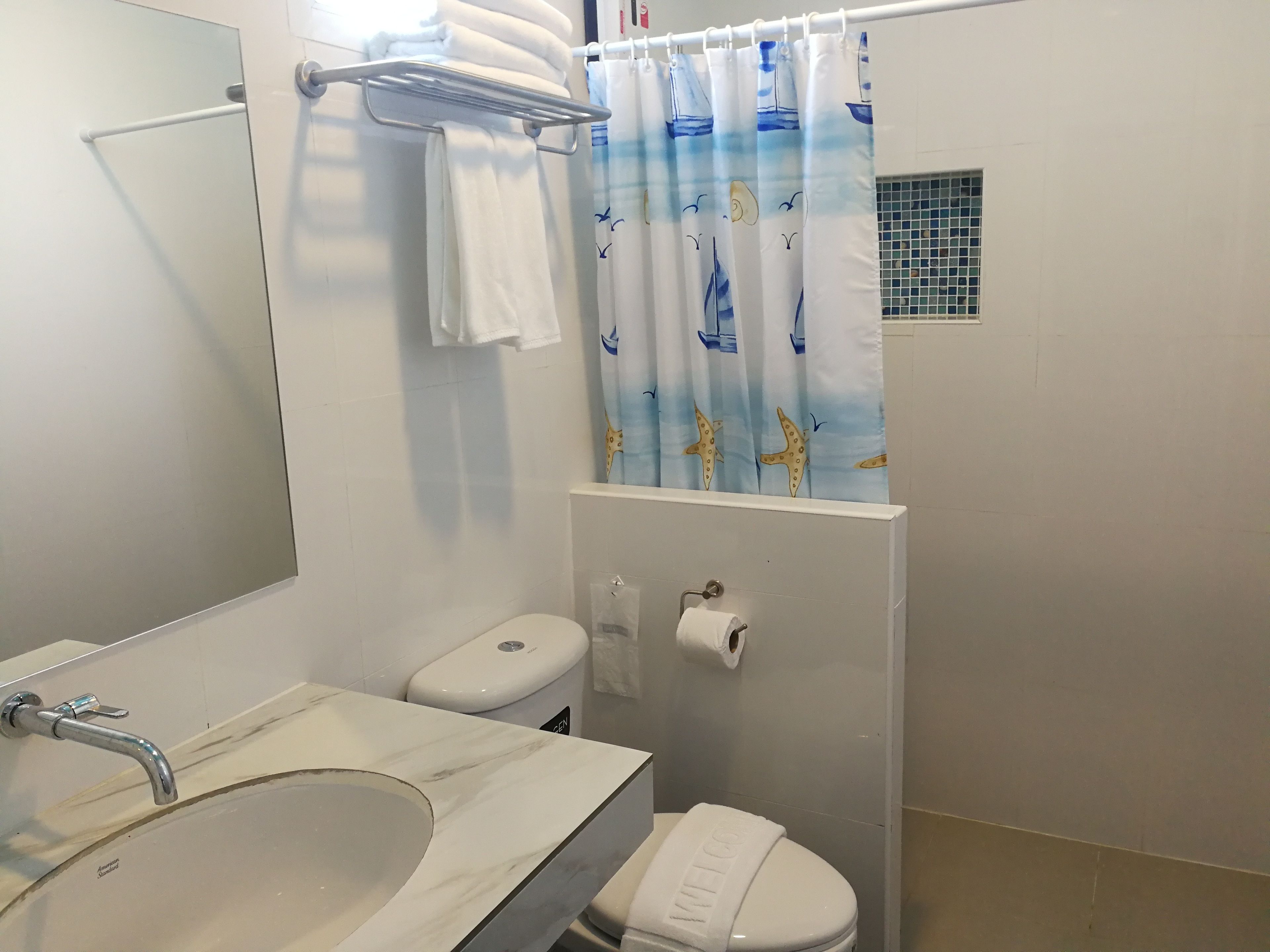 standard twin room | bathroom | shower, free toiletries, hair dryer, towels