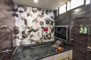 Separate tub and shower, free toiletries, hair dryer, slippers