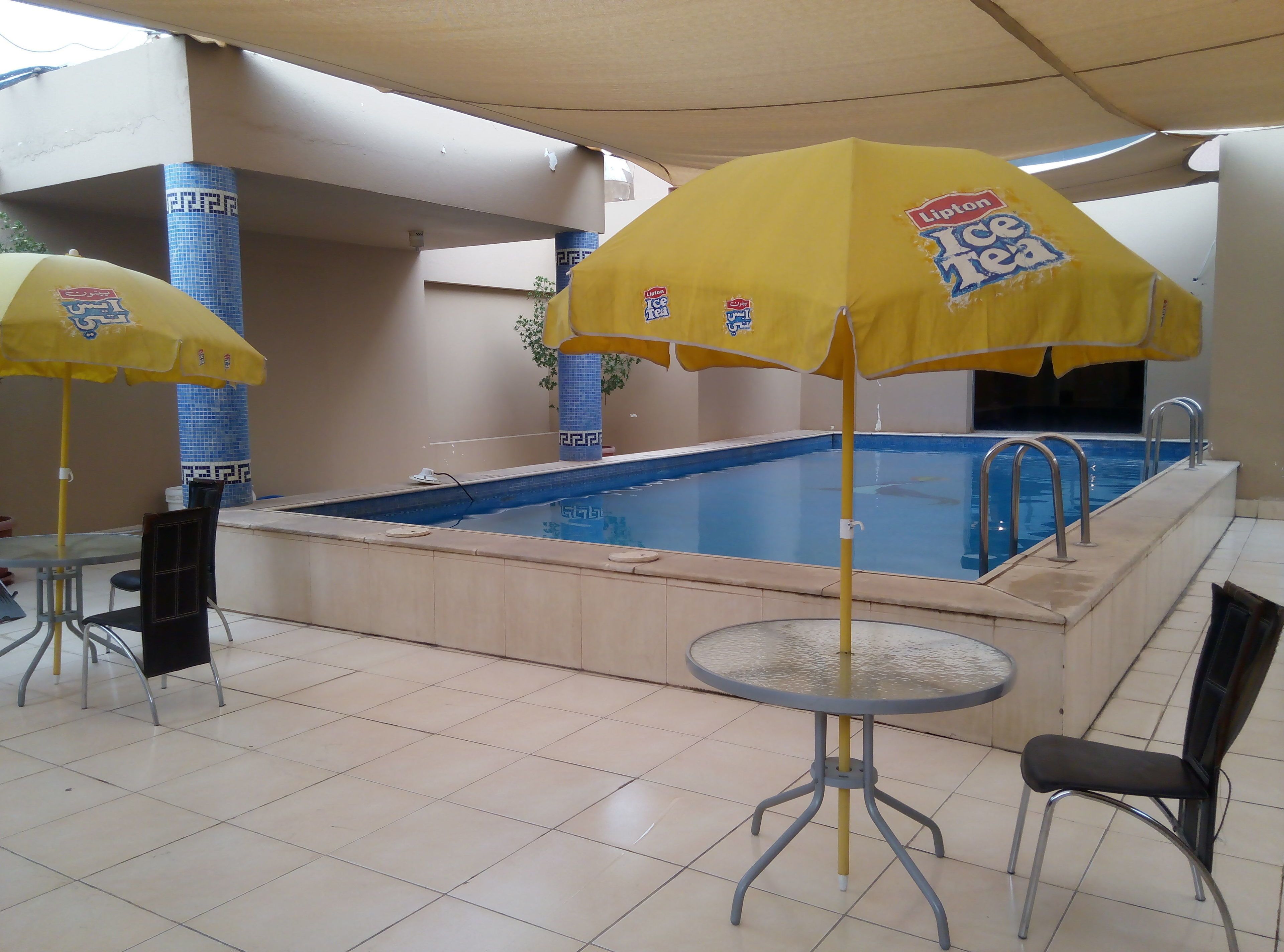 Outdoor pool, pool umbrellas, sun loungers