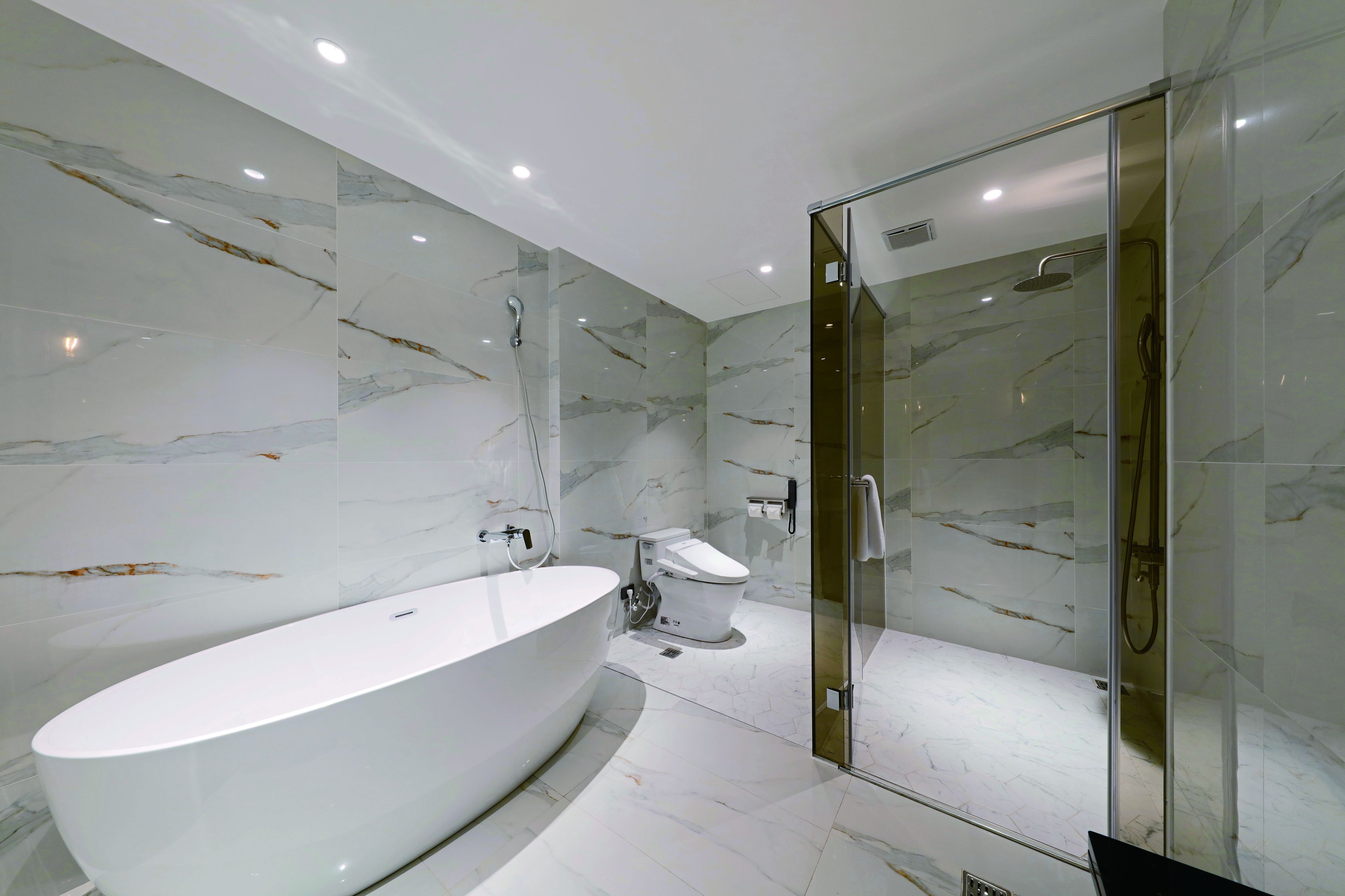 superior quadruple room | bathroom | separate bathtub and shower, hair dryer, slippers, towels