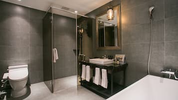 Separate bathtub and shower, hair dryer, slippers, towels