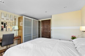Departamento exclusivo, 1 cama Queen size | 1 habitación, cortinas blackout y tabla de planchar con plancha 
