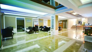 A spacious lobby with a polished marble floor, seating areas, and a staircase leading to upper levels. - Doktorun Oteli Haymana (Haymana)