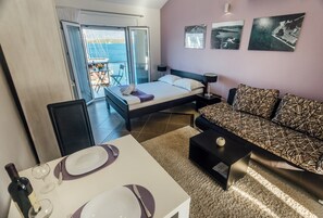 Studio, 1 Queen Bed, Balcony, Sea View | Living area | Flat-screen TV - Apartments MONET (Tivat)
