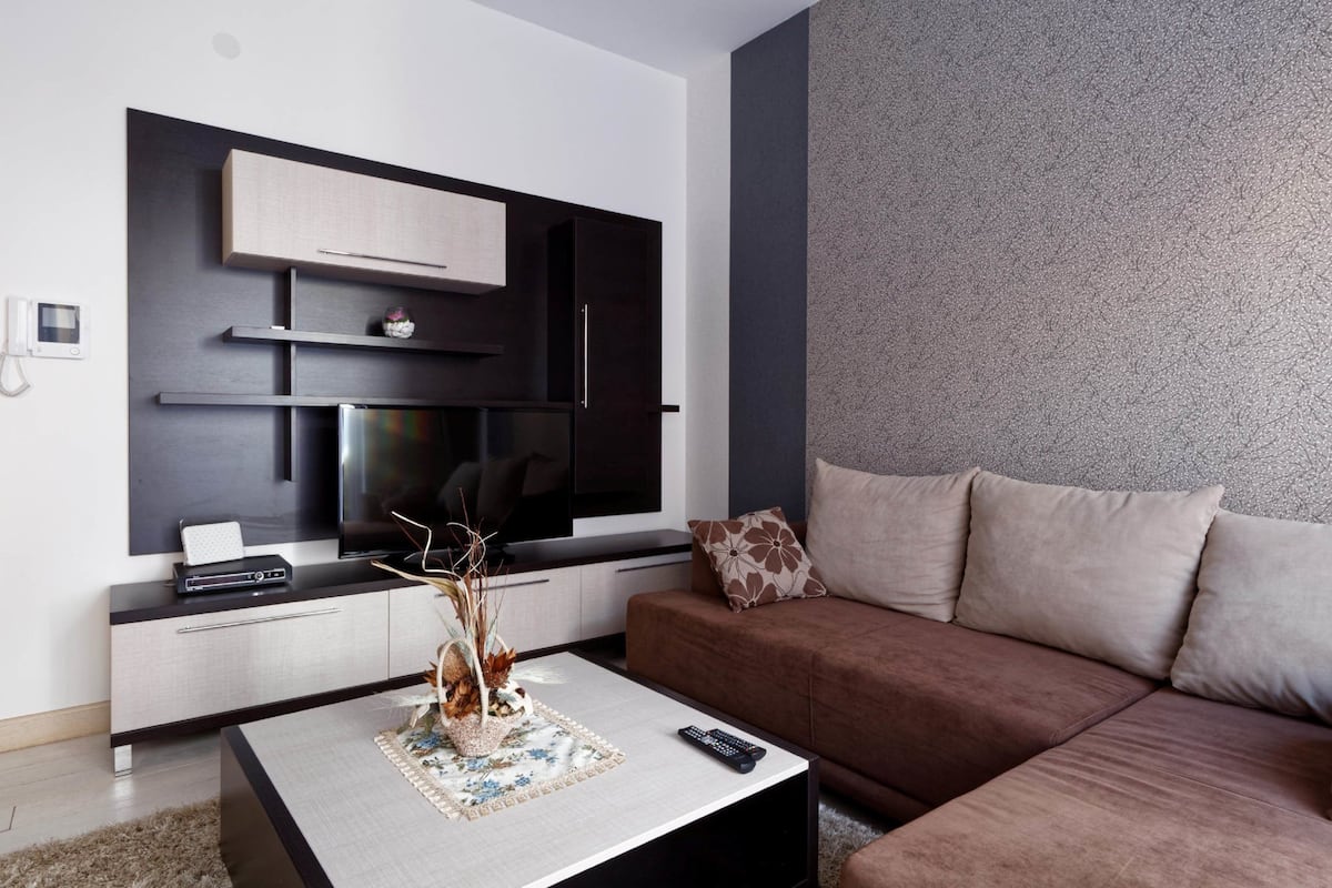 Apartment, 1 Bedroom, Sea View | Living room | Flat-screen TV