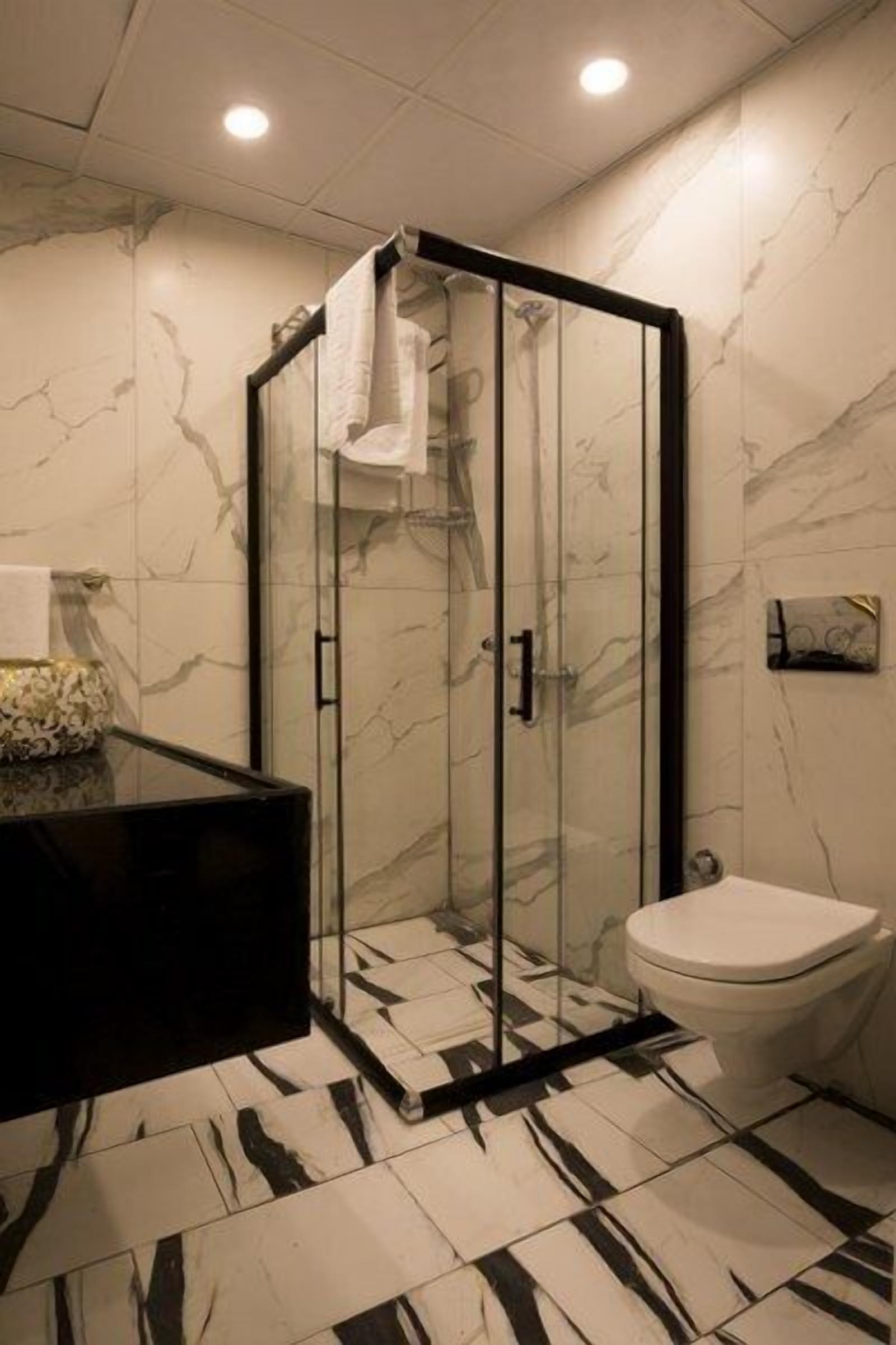 family double room, 1 double bed, smoking | bathroom | shower, free toiletries, hair dryer, slippers