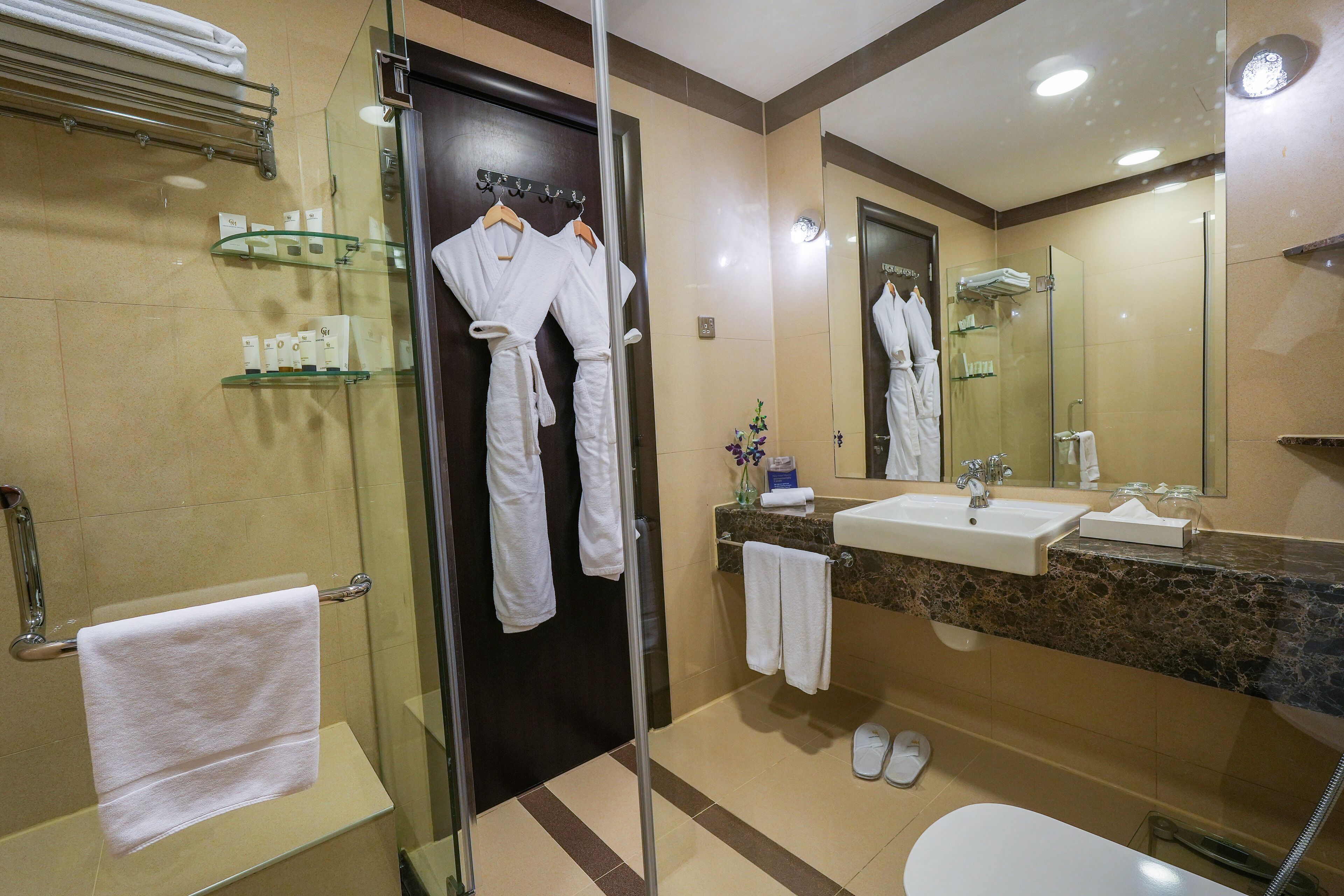 deluxe double room, 1 king bed | bathroom | shower, free toiletries, hair dryer, bathrobes