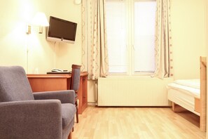 Desk, blackout curtains, iron/ironing board, rollaway beds