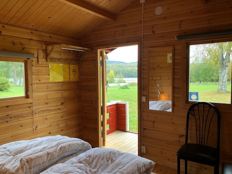 Standard Cottage, 2 Single Beds, Shared Bathroom, River View. Hammarstrands Camping