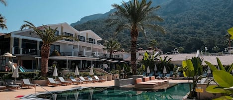 Seasonal outdoor pool, pool umbrellas, pool loungers