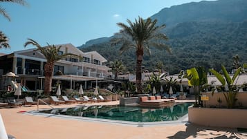 Seasonal outdoor pool, pool umbrellas, pool loungers