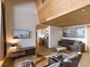 Deluxe Apartment, 2 Bedrooms, Balcony, Mountain View | Living area | 0-inch flat-screen TV with satellite channels, TV, heated floors