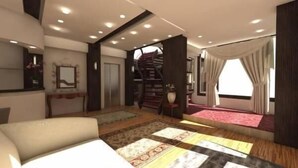 Ein modernes Schlafzimmer mit einem großen Bett, einer Treppe und Blick ins Freie.