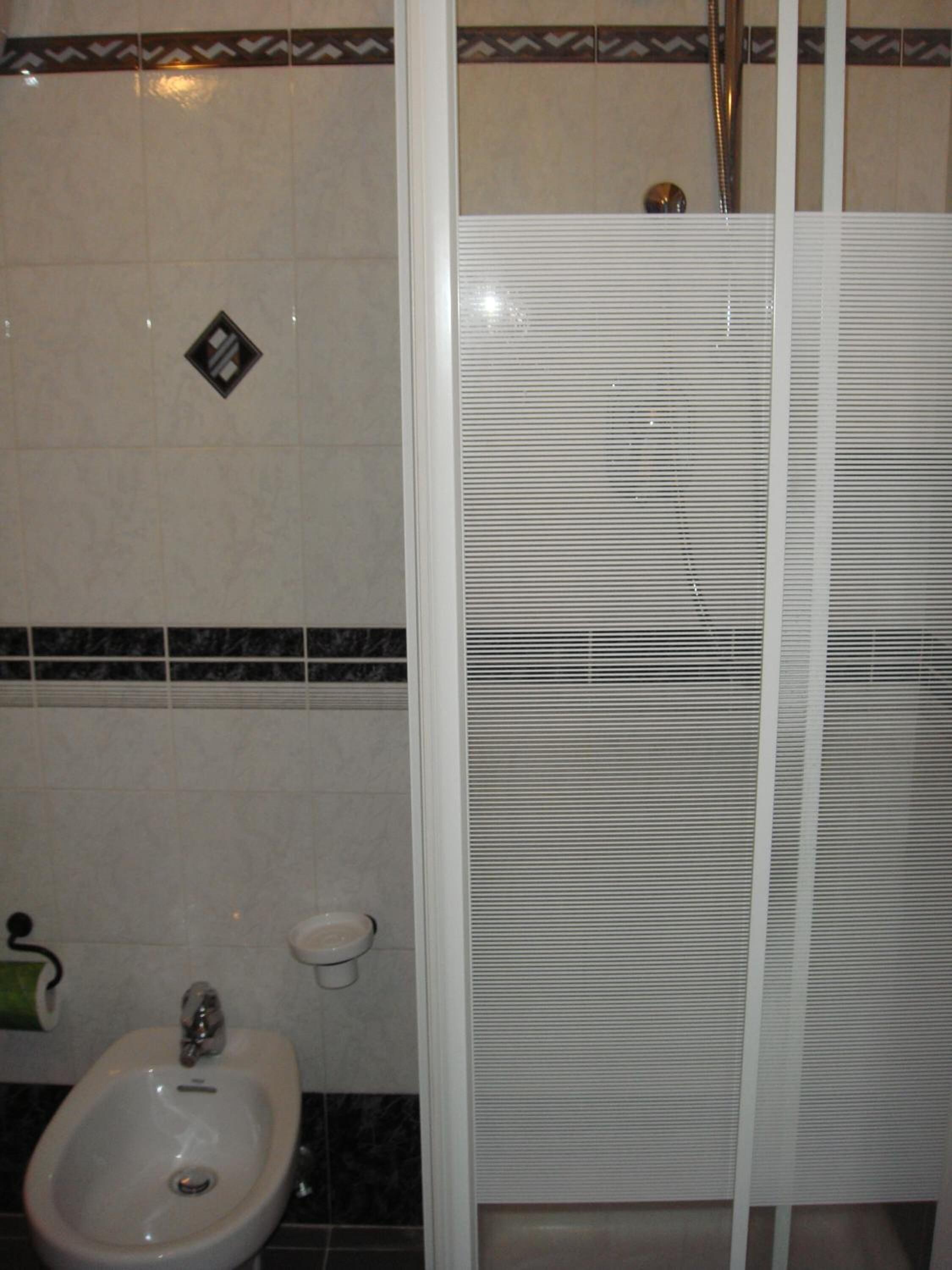 shower, free toiletries, slippers, bidet