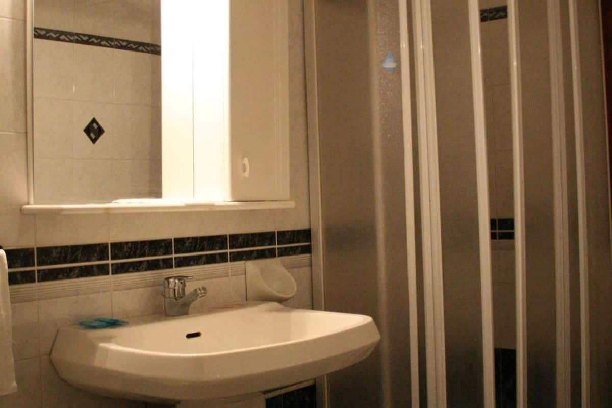 shower, free toiletries, slippers, bidet