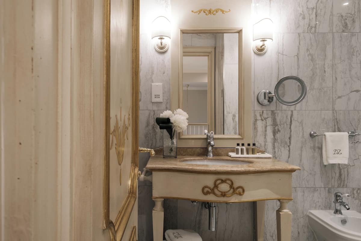 signature suite | bathroom | free toiletries, slippers, towels, soap